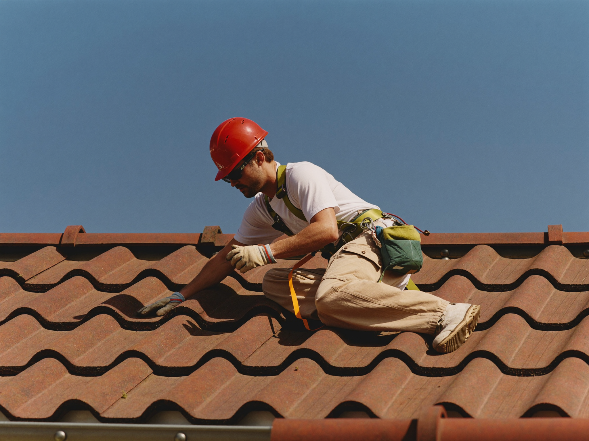 Roofer safely working on a Bristol roof