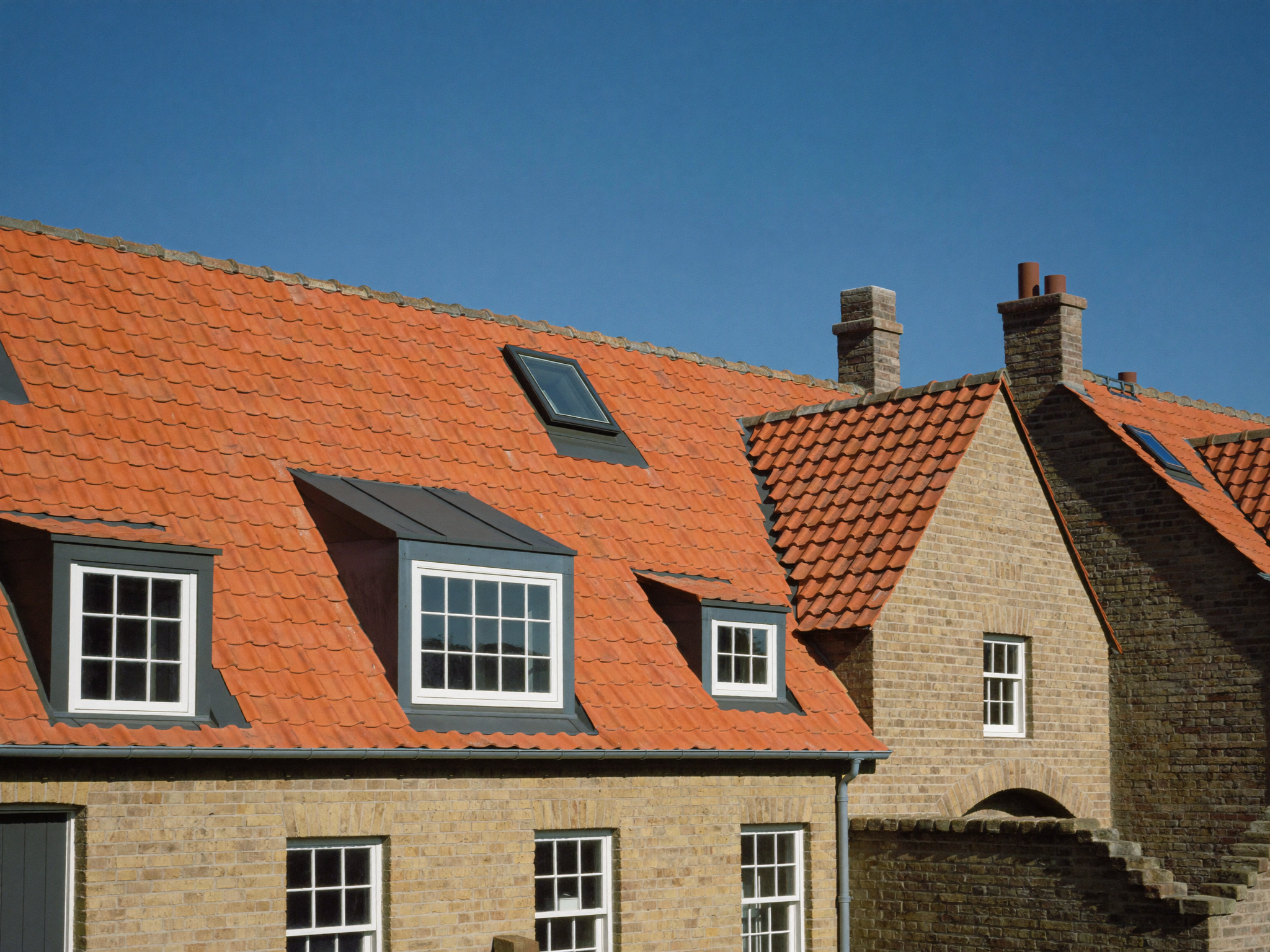 Ridge tiles re-bedded and repointed on a roof in Kingswood, Bristol